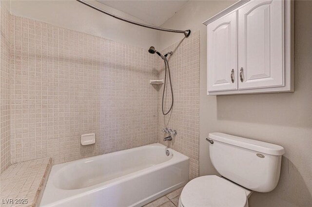 full bath featuring toilet, shower / washtub combination, and tile patterned flooring