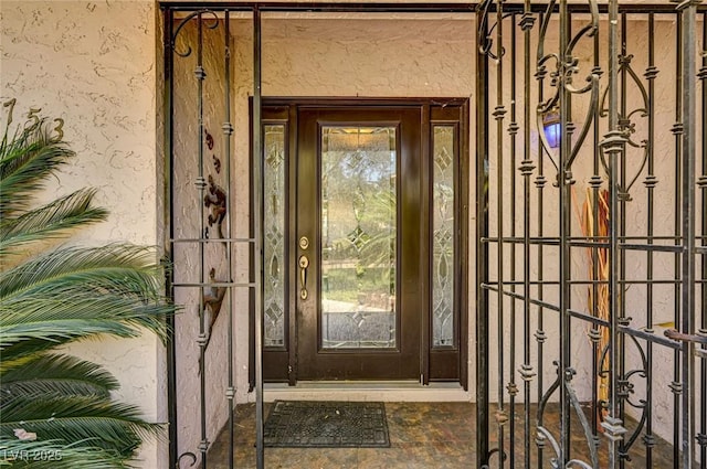 doorway to property with stucco siding