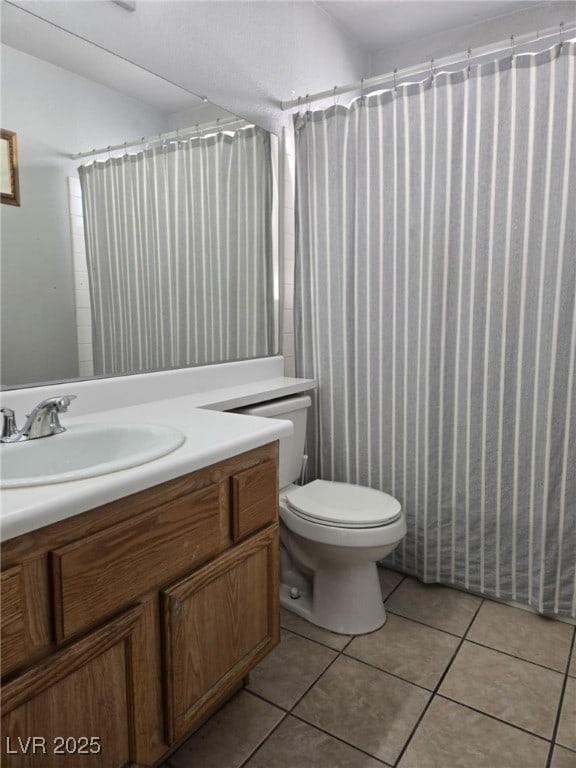 3512 Trilogy Dr, Las Vegas, NV 89108 - full bathroom with vanity, a shower with shower curtain, tile patterned floors, and toilet
