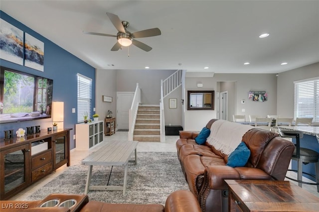 living room with recessed lighting, a ceiling fan, and stairway