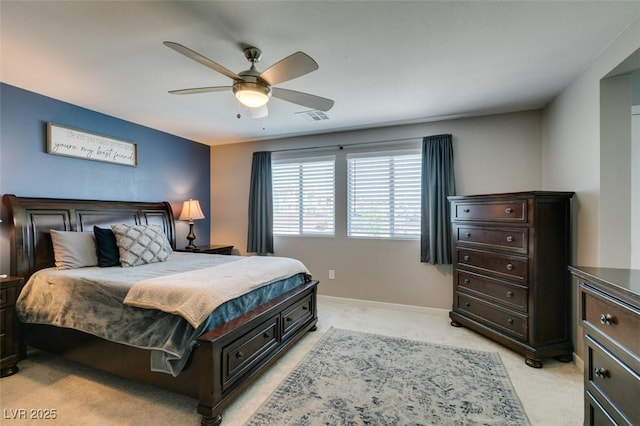 bedroom with baseboards, ceiling fan, light carpet, and visible vents