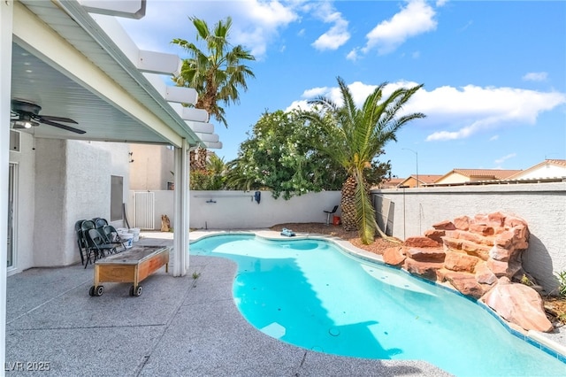 view of pool featuring a fenced in pool, a fenced backyard, ceiling fan, and a patio
