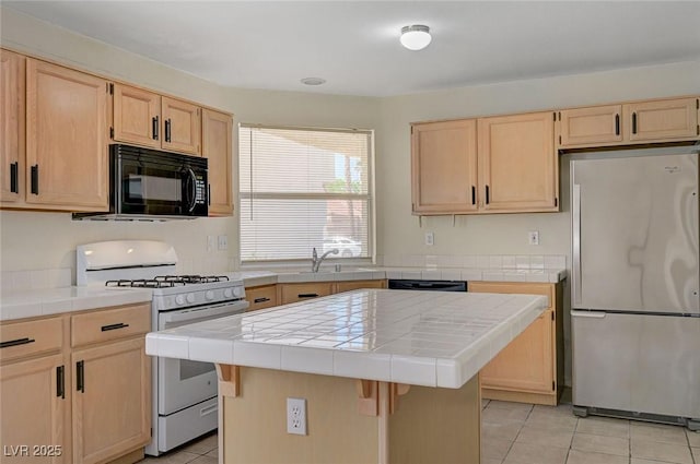 kitchen featuring tile counters, light tile patterned floors, light brown cabinetry, and black appliances