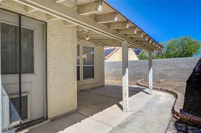 view of patio with fence
