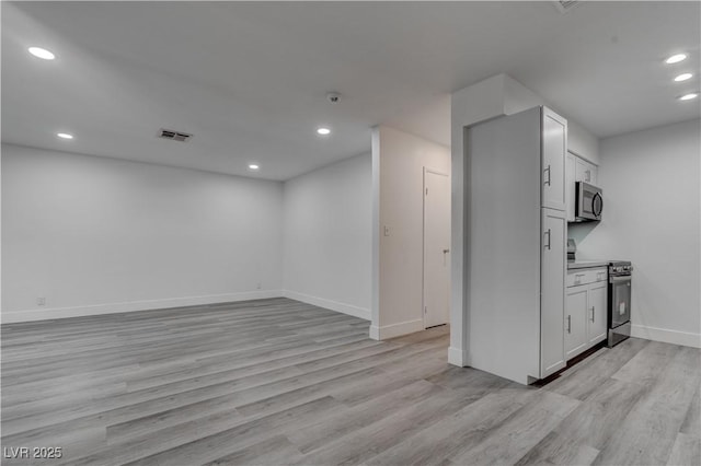 4432 Ash Ave, Las Vegas, NV 89110 - below grade area with baseboards, light wood finished floors, recessed lighting, and visible vents