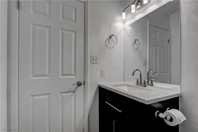 4432 Ash Ave, Las Vegas, NV 89110 - bathroom featuring vanity and a textured wall