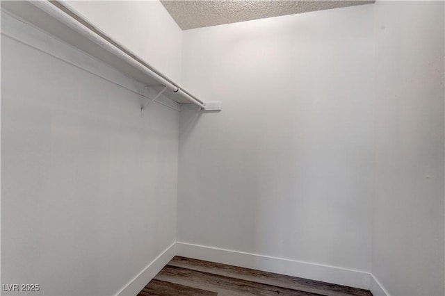 4432 Ash Ave, Las Vegas, NV 89110 - spacious closet with dark wood finished floors
