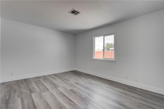 4432 Ash Ave, Las Vegas, NV 89110 - empty room with baseboards, visible vents, and wood finished floors