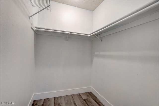 4432 Ash Ave, Las Vegas, NV 89110 - spacious closet featuring wood finished floors