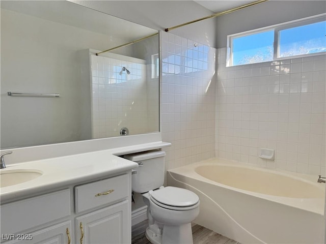 bathroom with vanity, shower / tub combination, wood finished floors, and toilet