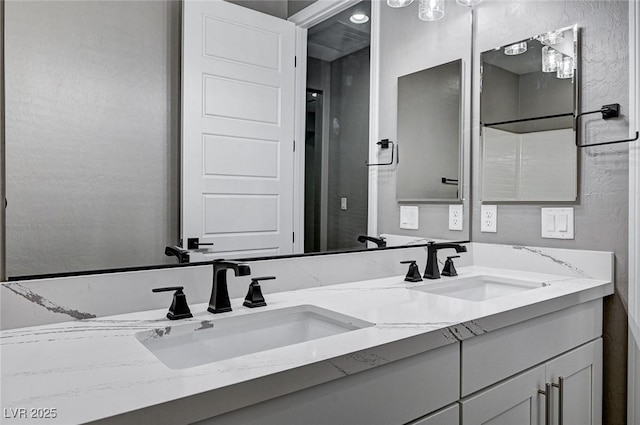 bathroom with double vanity and a sink