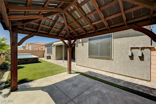 view of patio / terrace with fence and a gazebo