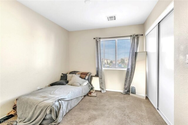 4195 Story Rock St, Las Vegas, NV 89115 - carpeted bedroom featuring baseboards, visible vents, multiple windows, and a closet