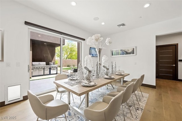dining room with visible vents, recessed lighting, light wood-style floors, and baseboards