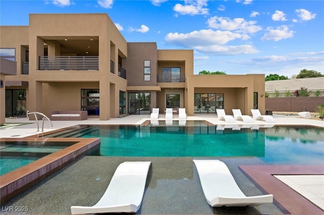 view of swimming pool featuring a patio, an in ground hot tub, a fenced in pool, and outdoor lounge area