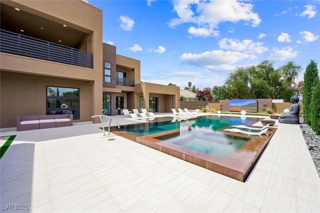 view of pool with a fenced in pool, fence, an in ground hot tub, and a patio area