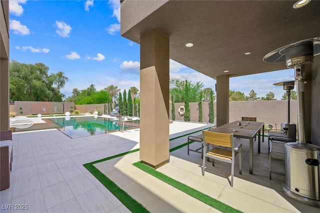 view of swimming pool featuring a fenced in pool, a fenced backyard, a patio area, and outdoor dining area