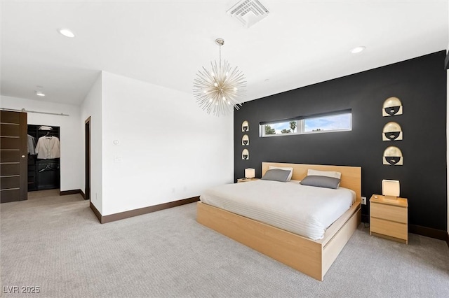carpeted bedroom featuring recessed lighting, baseboards, visible vents, and an inviting chandelier