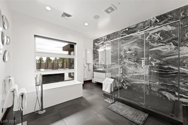 full bathroom with visible vents, recessed lighting, a marble finish shower, and vanity