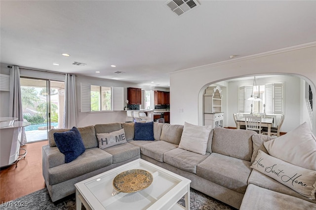 10519 Bella Camrosa Dr, Las Vegas, NV 89141 - living area featuring visible vents, arched walkways, and recessed lighting