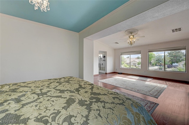 10519 Bella Camrosa Dr, Las Vegas, NV 89141 - bedroom featuring visible vents, wood finished floors, baseboards, lofted ceiling, and ornamental molding
