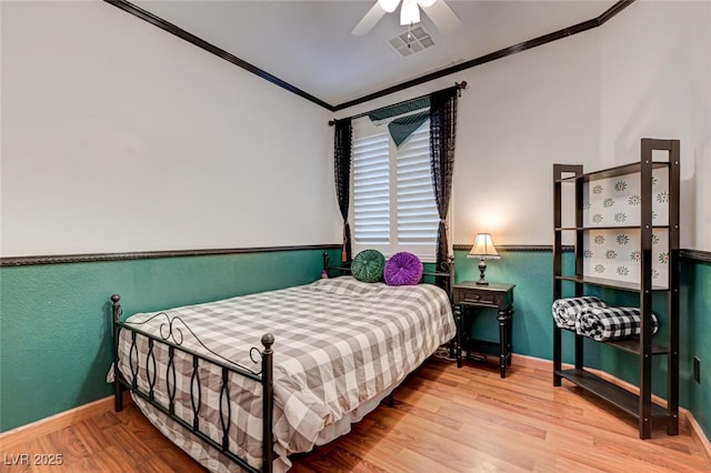 10519 Bella Camrosa Dr, Las Vegas, NV 89141 - bedroom with crown molding, visible vents, wood finished floors, baseboards, and a ceiling fan