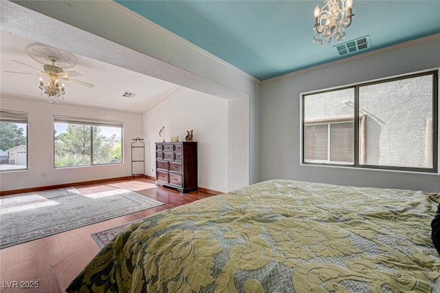 10519 Bella Camrosa Dr, Las Vegas, NV 89141 - bedroom with visible vents, ornamental molding, and wood finished floors