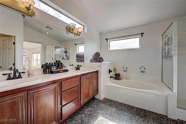 10519 Bella Camrosa Dr, Las Vegas, NV 89141 - full bathroom with a garden tub, a sink, lofted ceiling, and a stall shower