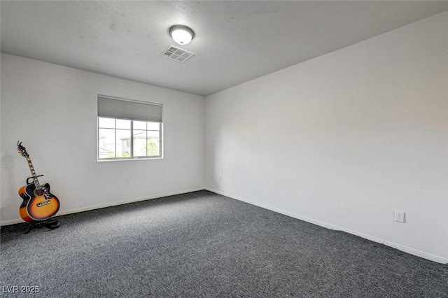 10519 Bella Camrosa Dr, Las Vegas, NV 89141 - empty room featuring baseboards, visible vents, and dark carpet