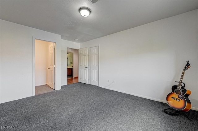 10519 Bella Camrosa Dr, Las Vegas, NV 89141 - unfurnished bedroom with baseboards and carpet flooring