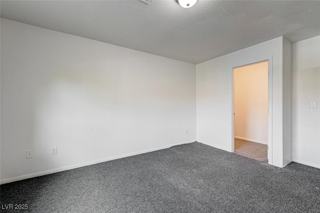 10519 Bella Camrosa Dr, Las Vegas, NV 89141 - empty room featuring baseboards and dark colored carpet
