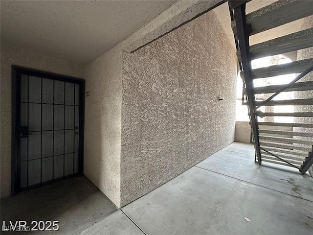 entrance to property with stucco siding