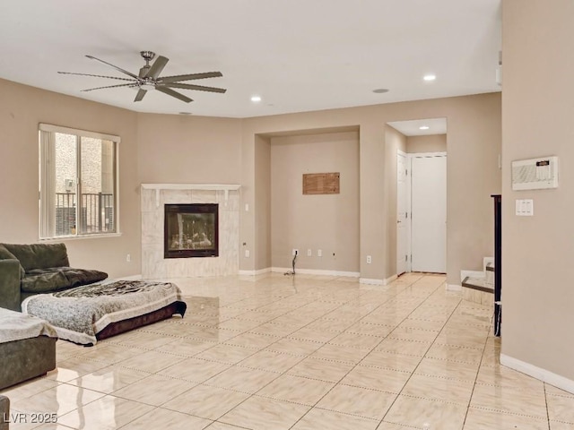 living area featuring a ceiling fan, baseboards, recessed lighting, and light tile patterned floors