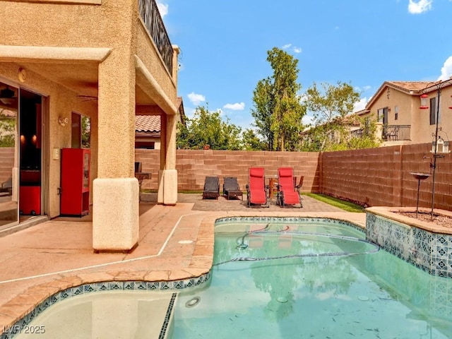 view of pool with a fenced in pool, a fenced backyard, and a patio area