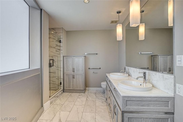full bath featuring a sink, visible vents, a shower stall, and marble finish floor
