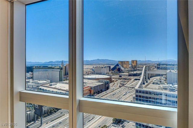 interior details featuring a mountain view and a city view