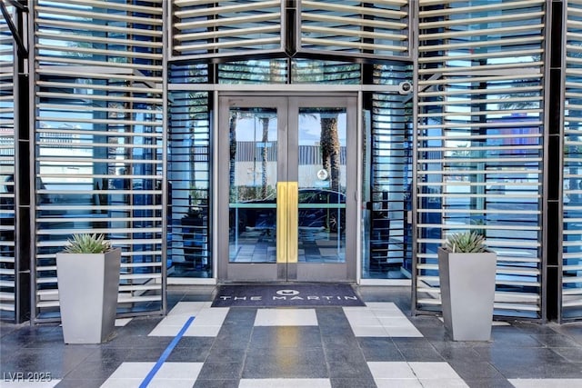 entrance to property featuring french doors