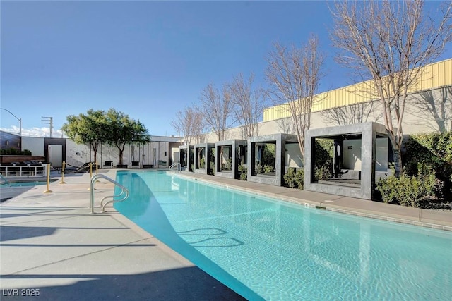 community pool featuring a patio area