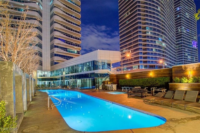 community pool featuring a patio area