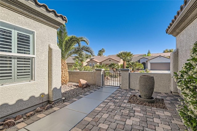 2372 Perrysburg Dr, Henderson, NV 89044 - view of patio / terrace with a gate and a residential view