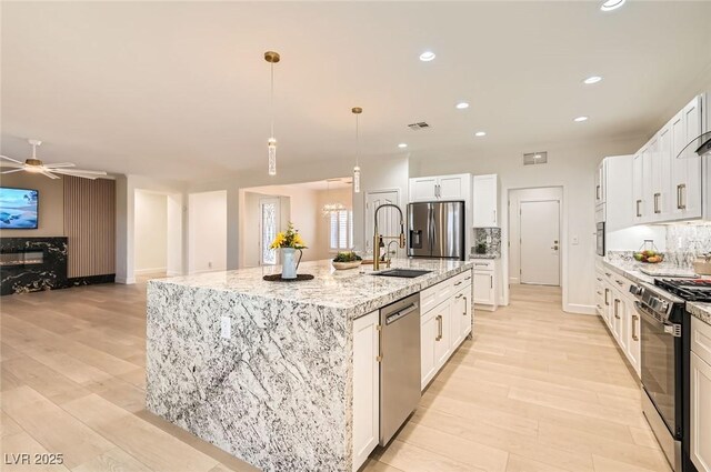 2372 Perrysburg Dr, Henderson, NV 89044 - kitchen featuring stainless steel appliances, a sink, a large island, ceiling fan, and recessed lighting