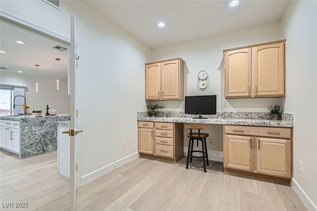 2372 Perrysburg Dr, Henderson, NV 89044 - office space featuring built in study area, light wood finished floors, recessed lighting, baseboards, and a sink