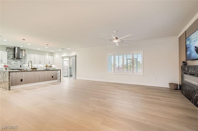 2372 Perrysburg Dr, Henderson, NV 89044 - unfurnished living room featuring recessed lighting, light wood-type flooring, ceiling fan, and baseboards