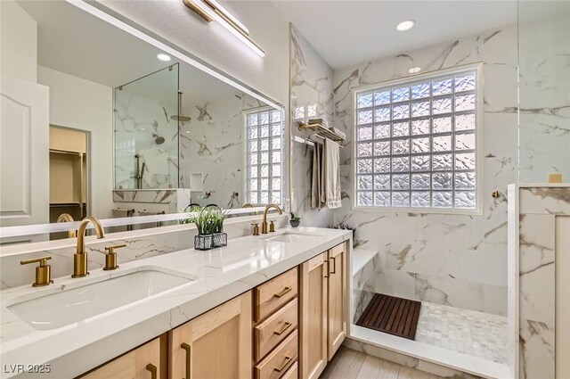 2372 Perrysburg Dr, Henderson, NV 89044 - bathroom with healthy amount of natural light, a marble finish shower, double vanity, a spacious closet, and recessed lighting