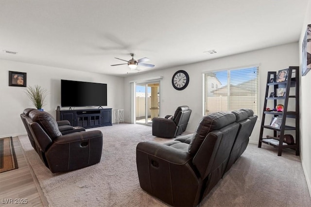 13 Deseo Ct, North Las Vegas, NV 89031 - living room with baseboards, ceiling fan, carpet flooring, and visible vents