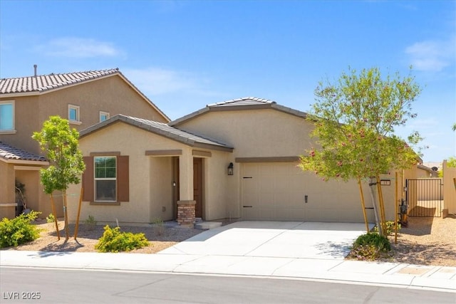 13 Deseo Ct, North Las Vegas, NV 89031 - view of front facade featuring fence, stucco siding, a tiled roof, an attached garage, and driveway