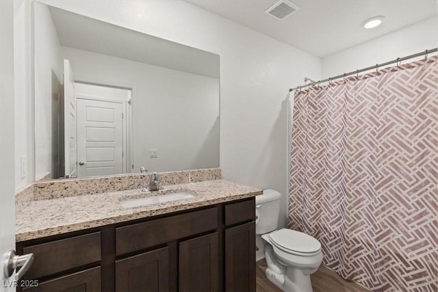 13 Deseo Ct, North Las Vegas, NV 89031 - full bathroom with visible vents, vanity, wood finished floors, toilet, and recessed lighting