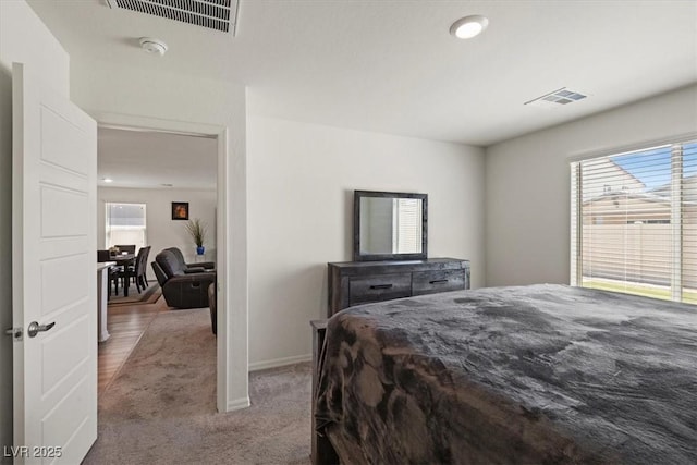 13 Deseo Ct, North Las Vegas, NV 89031 - bedroom with multiple windows, carpet, and visible vents