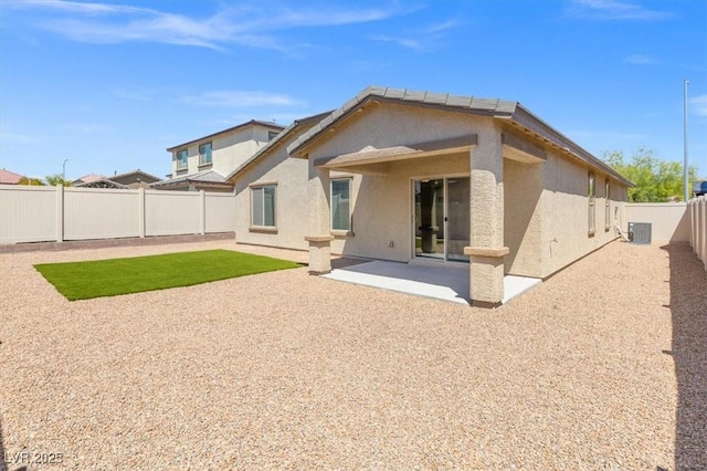 13 Deseo Ct, North Las Vegas, NV 89031 - back of house featuring a fenced backyard, central AC unit, stucco siding, and a patio area