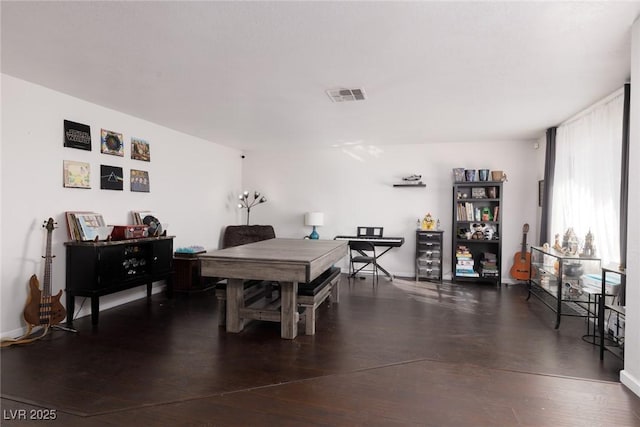 dining room with wood-type flooring and visible vents